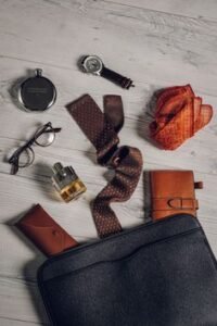 Minimal everyday carry gear for men laid out on a desk